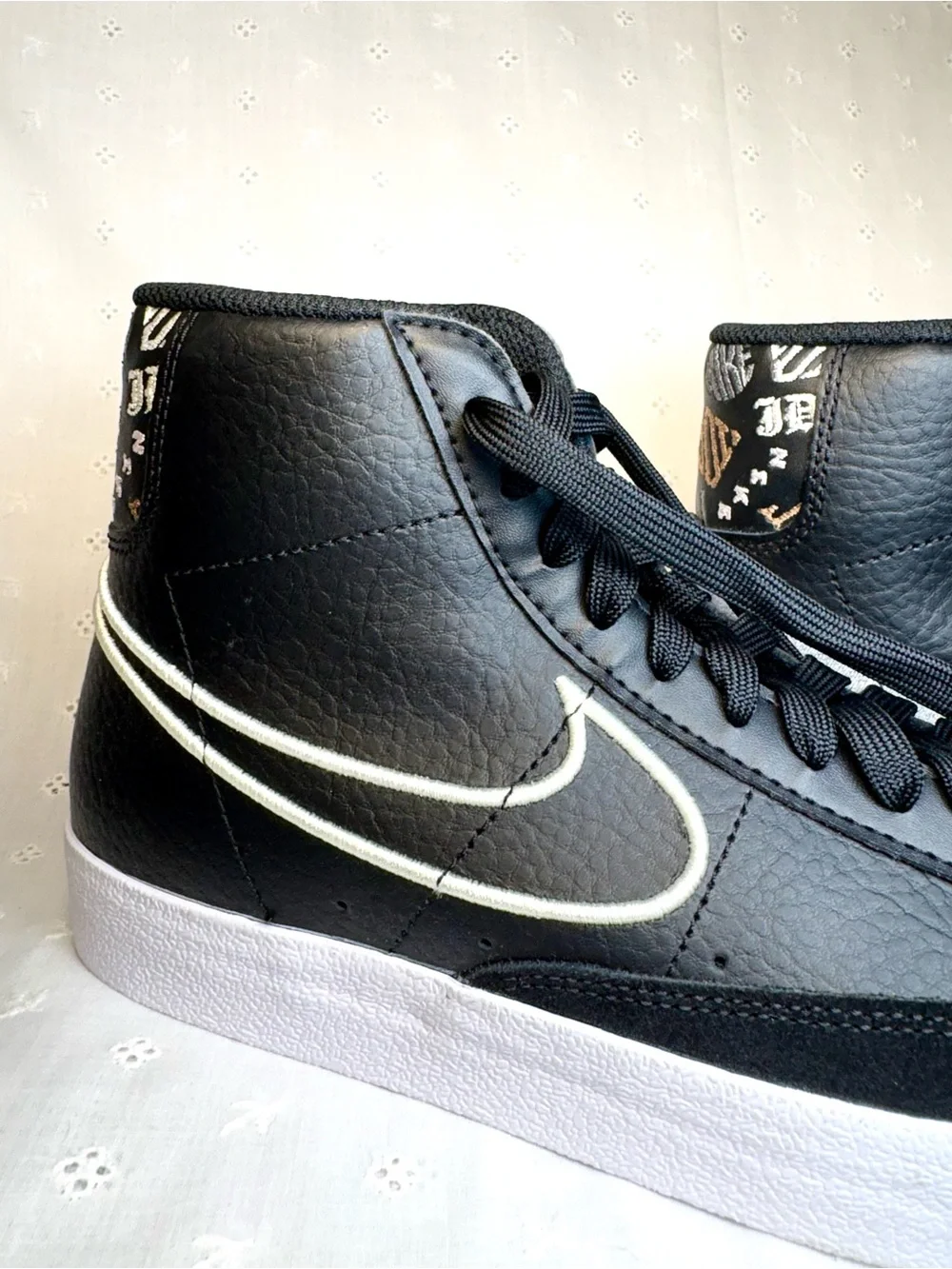 Nike Black High-Top Sneakers with White Tongue Text